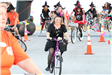 people dressed as witches riding bicycles