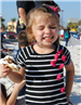girl smiling with a smore