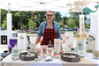 woman standing at her art booth