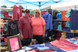 couple standing by t-shirt booth