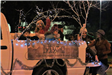 family riding on a float in the parade