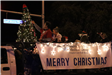 family riding on a float in the parade