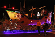family riding on a float in the parade