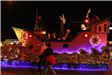 family riding on a float in the parade