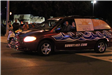 man driving a car in the parade