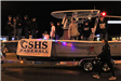 baseball team riding on a boat in the parade