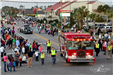 parade floats driving down Highway 59