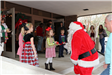 kids greeting Santa