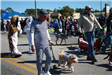 man walking dog in parade