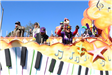 people throwing beads on mardi gras parade float