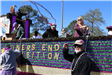 people throwing beads on mardi gras parade float