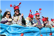 people throwing beads on mardi gras parade float