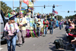 people throwing beads on mardi gras parade float