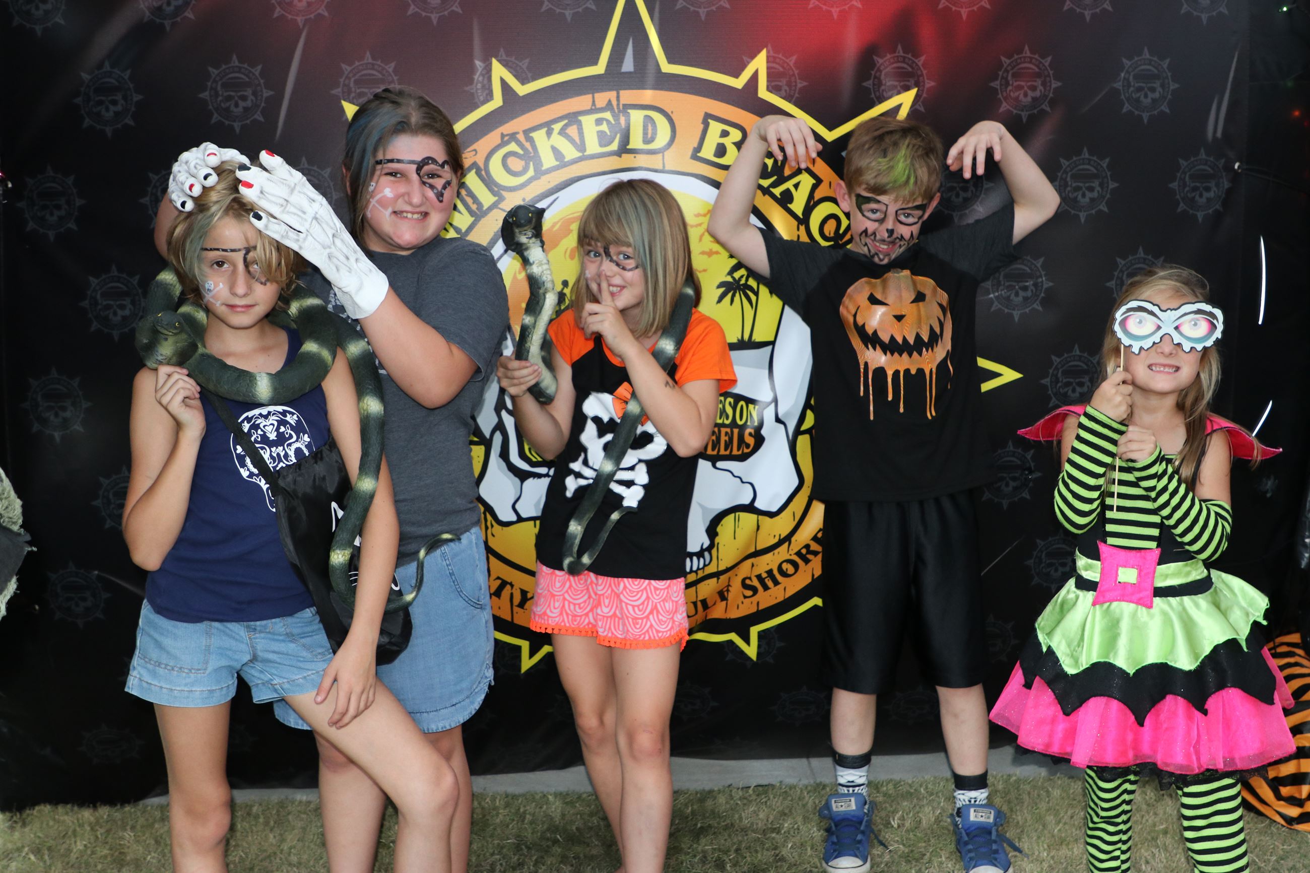 kids holding up props for picture