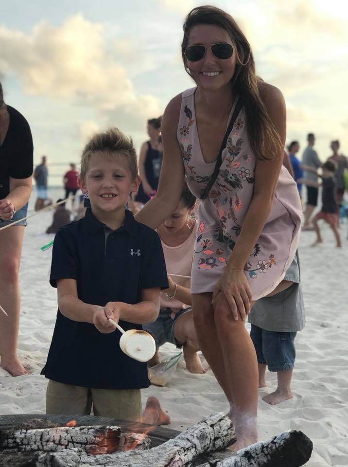 mom and son roasting marshmellows