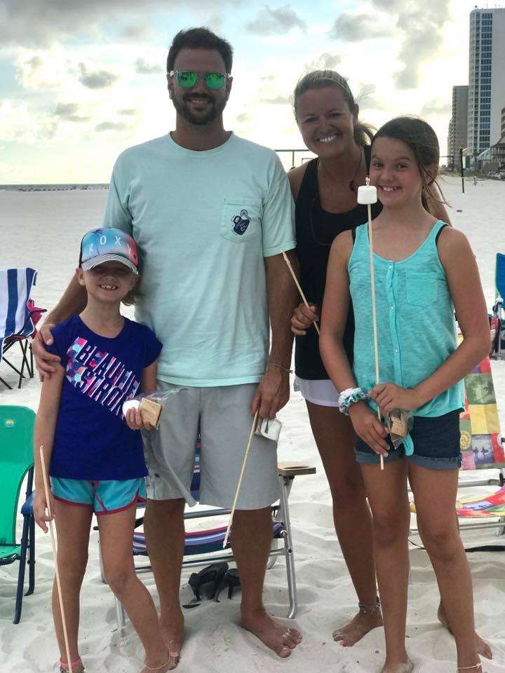 family posing for photo