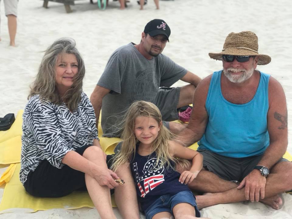 family posing for photo