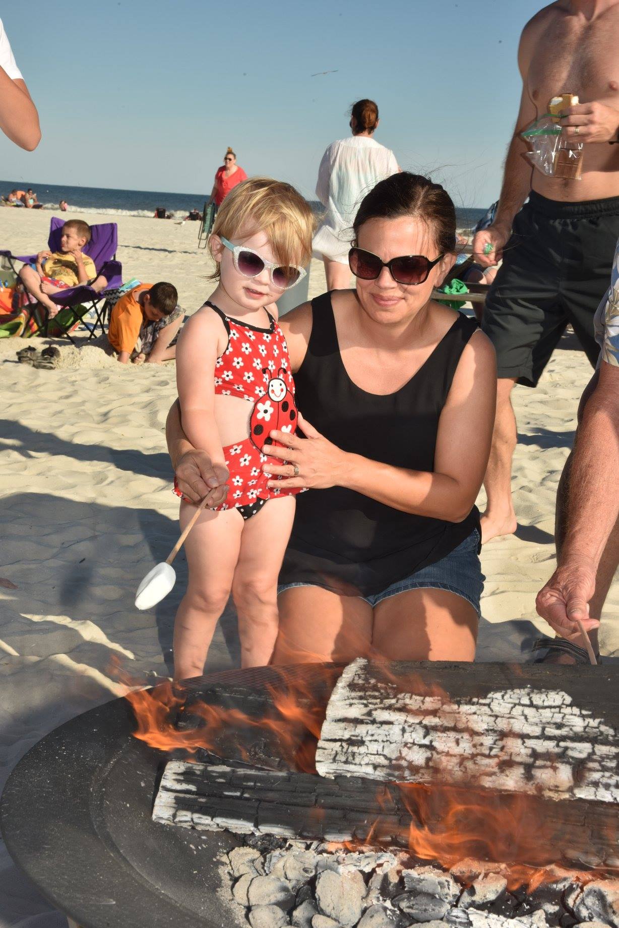 mom and daughter making smores