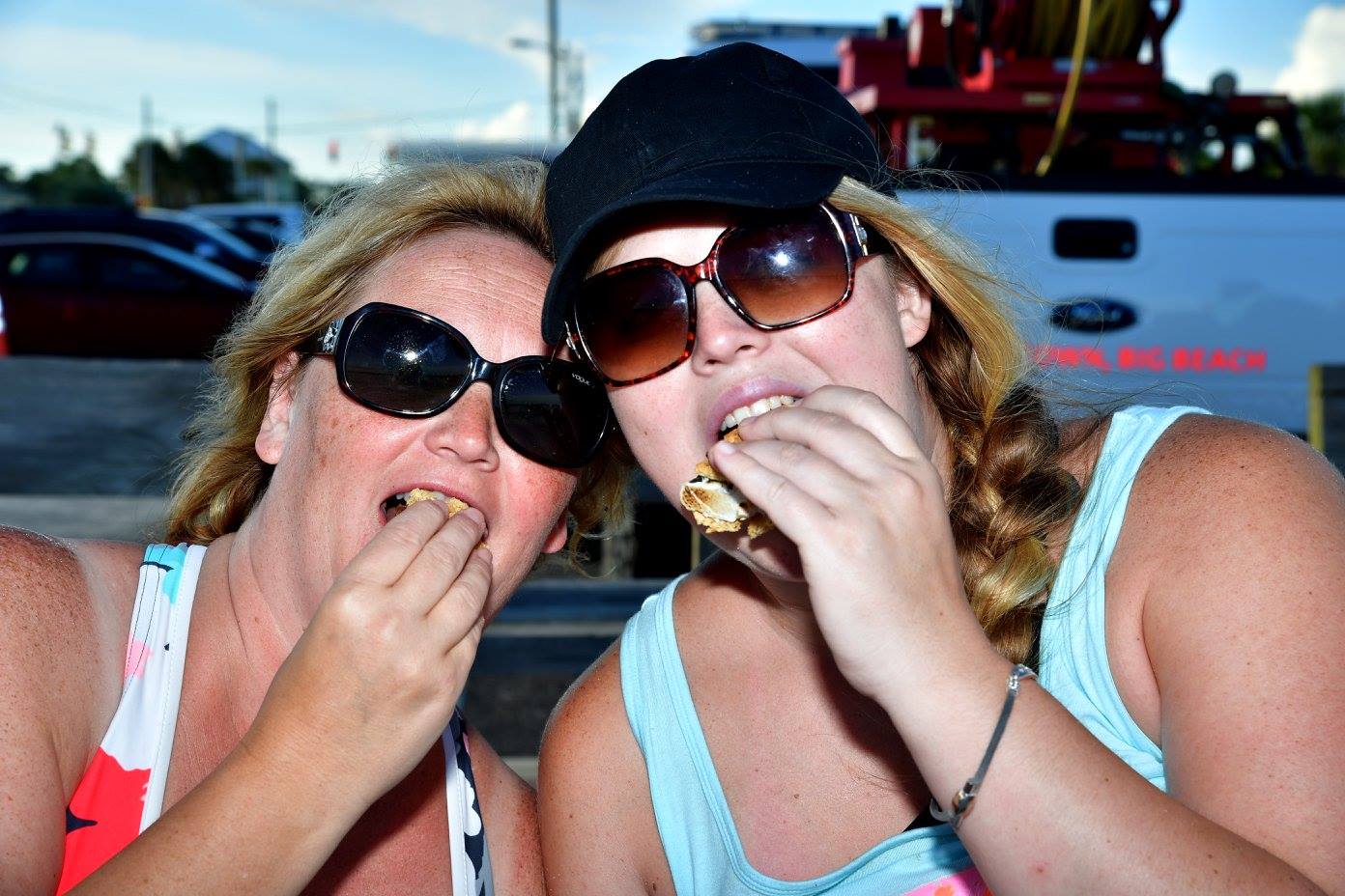 women eating a smore