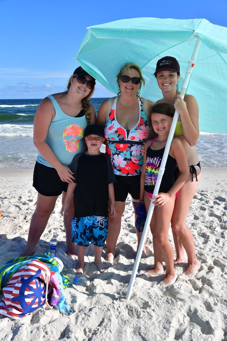 women smiling at the beach
