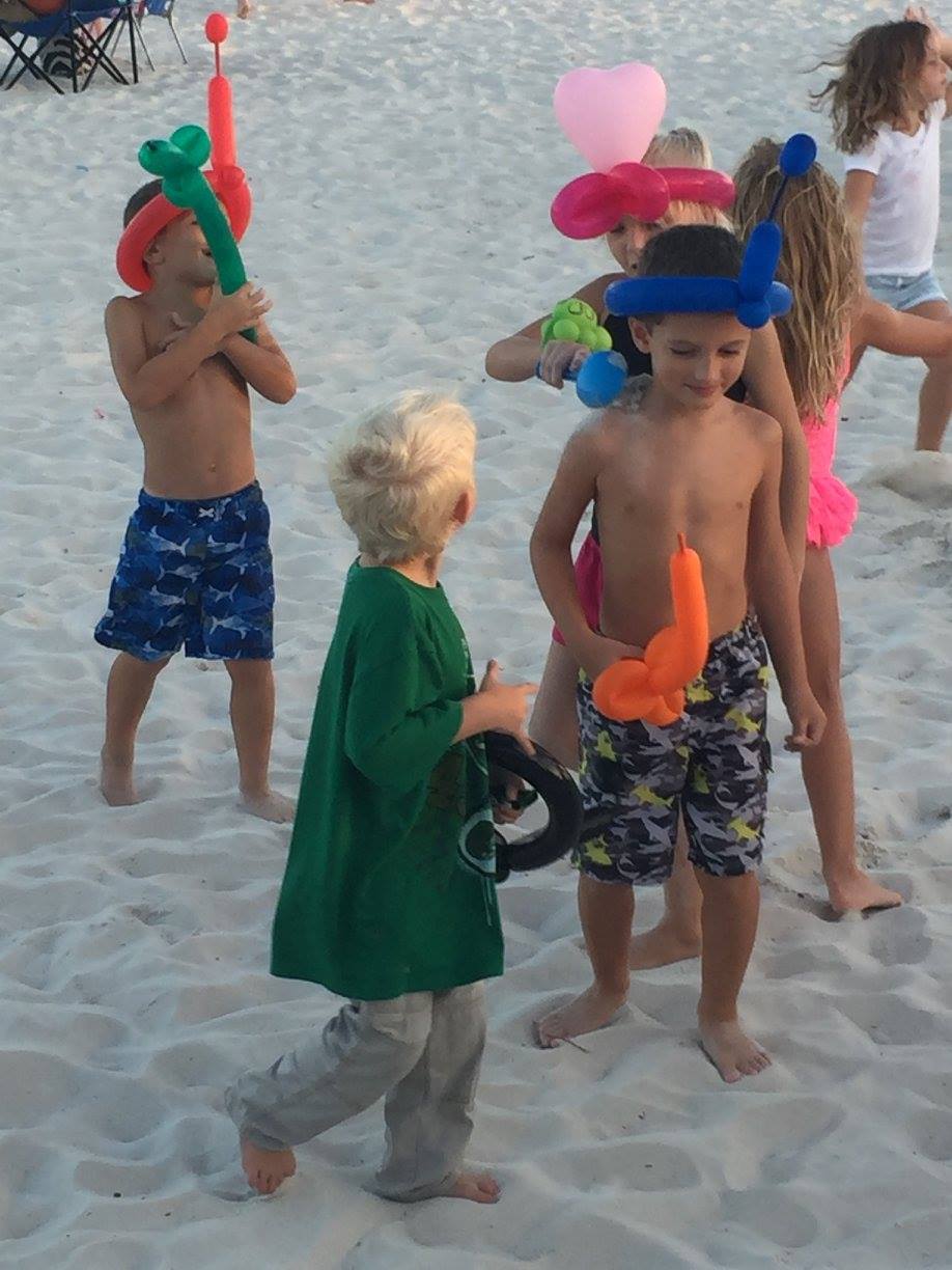 kids playing with balloon animals
