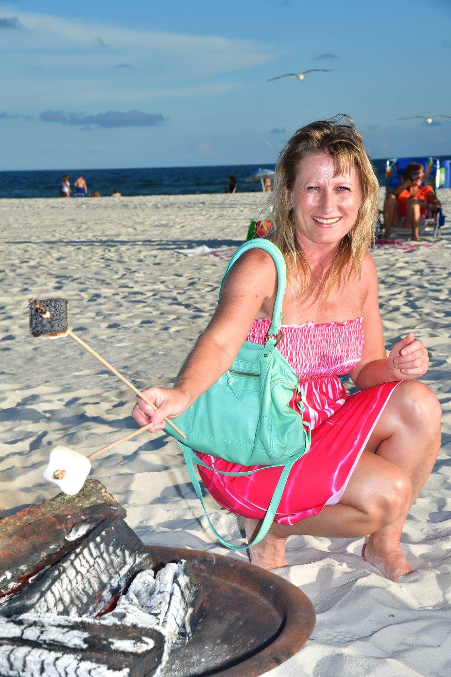 girl roasting a marshmellow