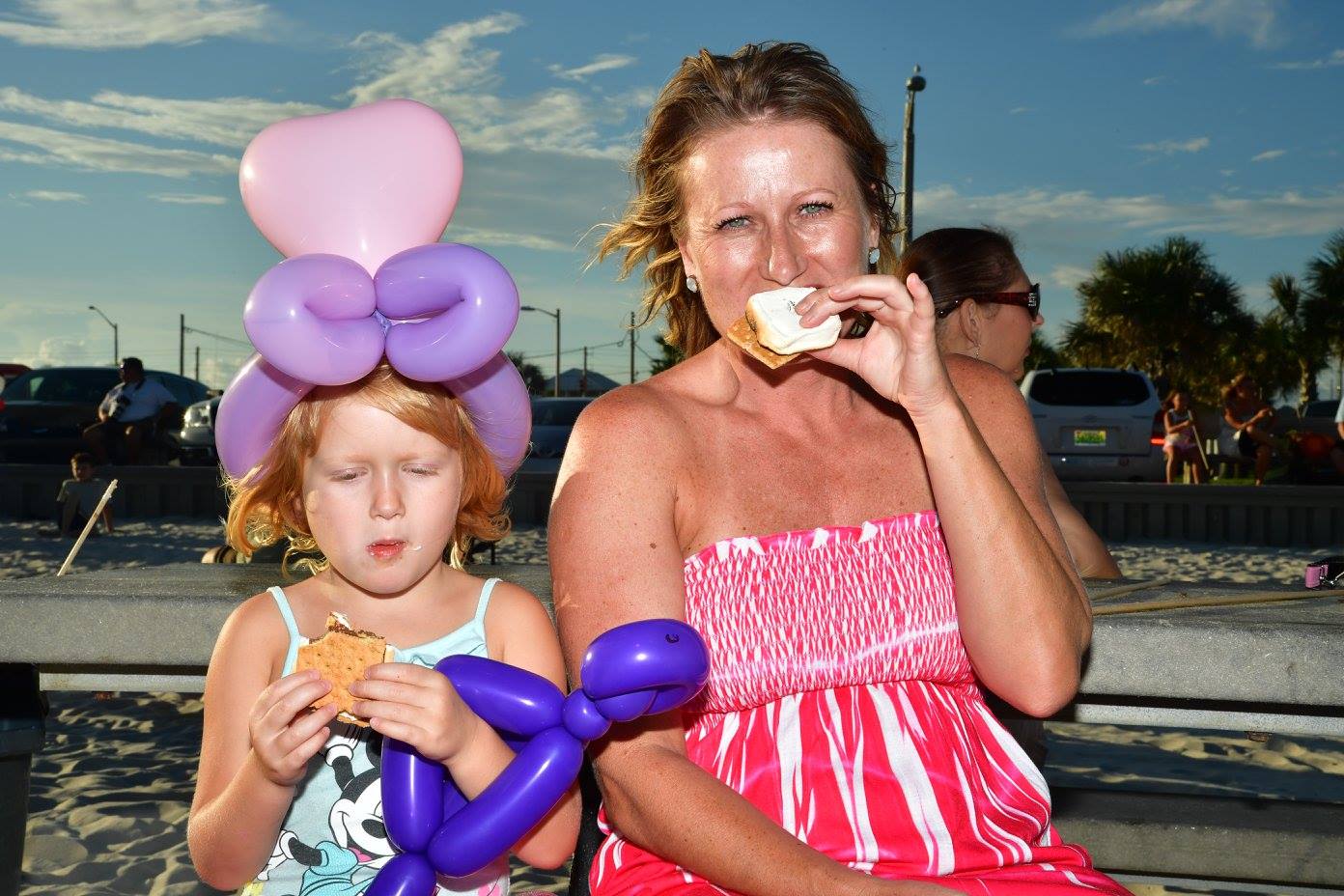 woman and daughter eating a smore