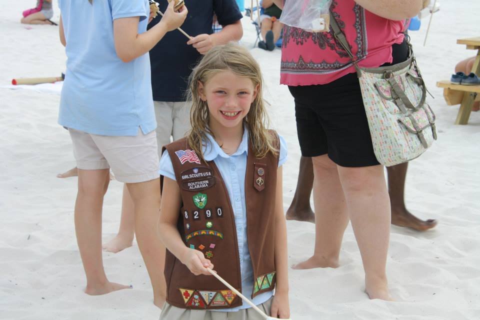 little girl roasting a smore