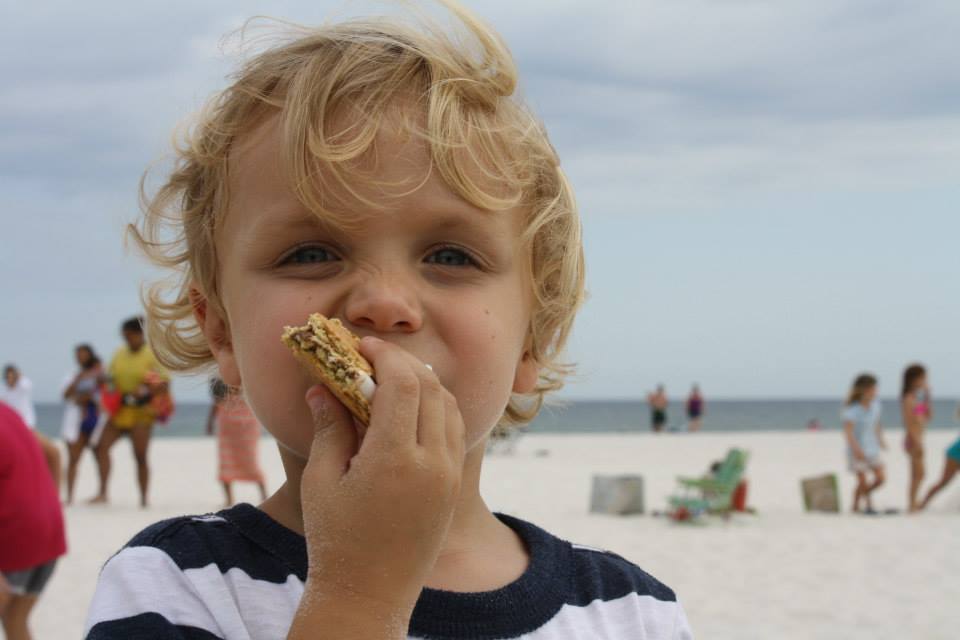 boy eating a smore