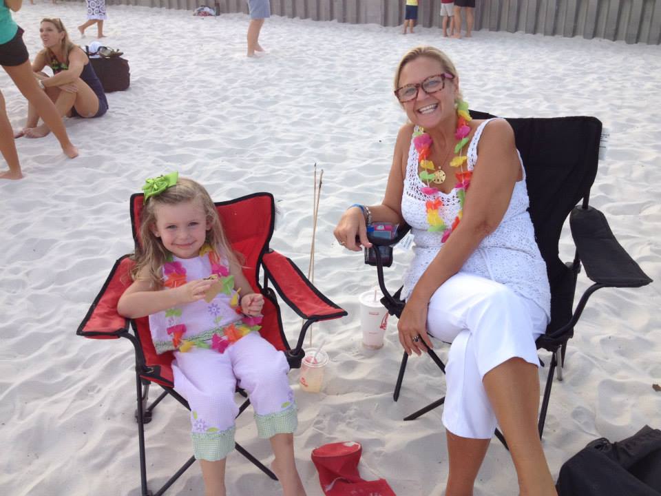 woman and daughter eating a smore