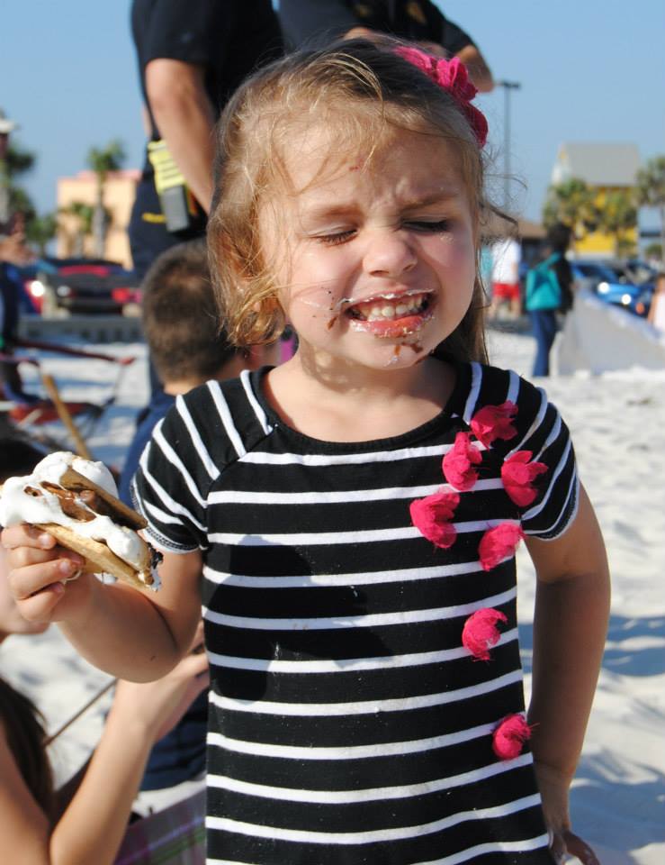 girl smiling with a smore