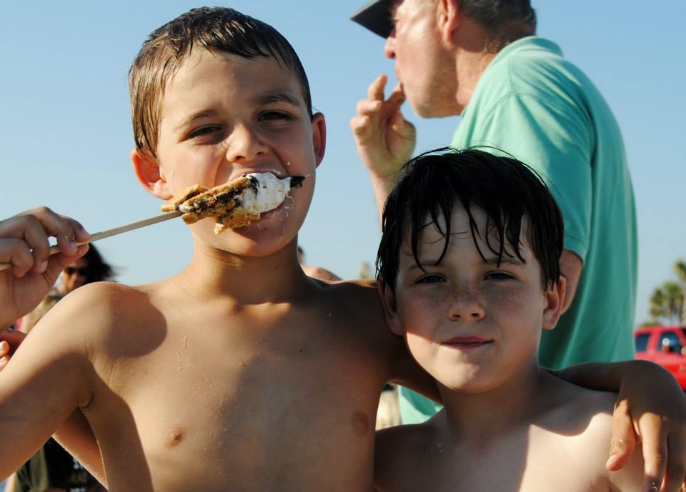 two boys eating a smore