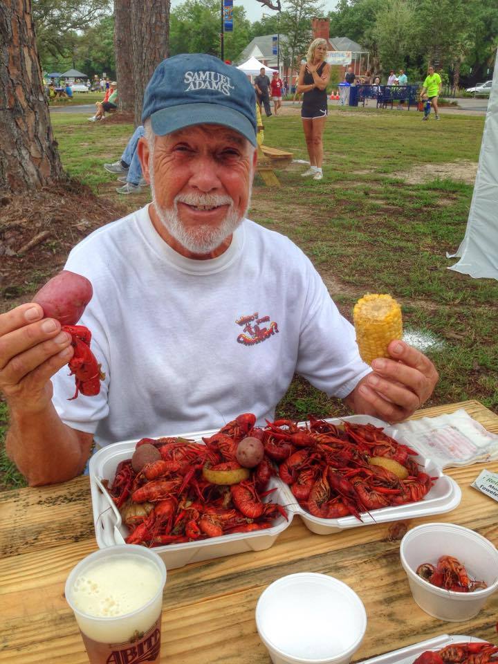 man eating crawfish