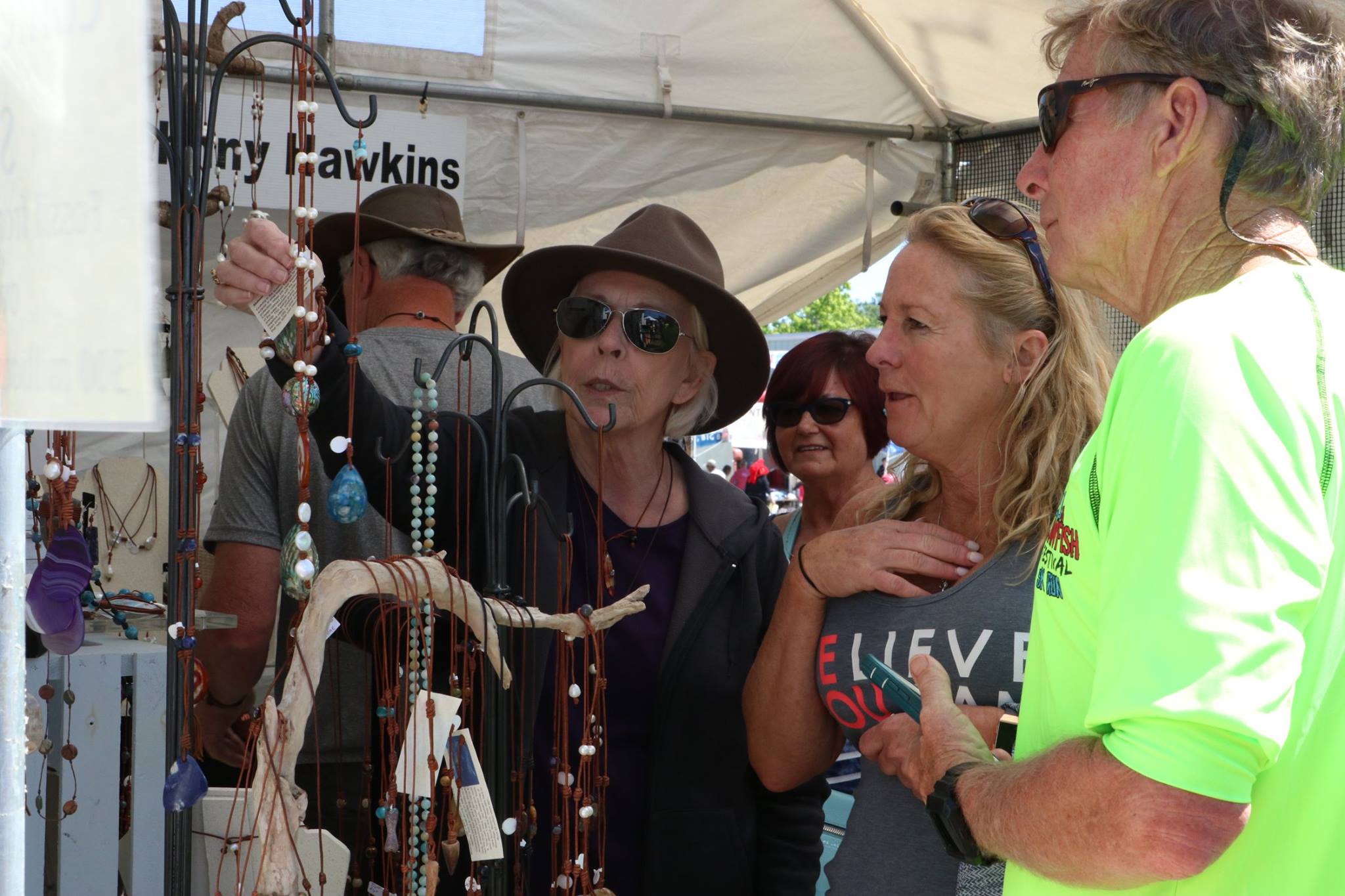 people looking at jewelry