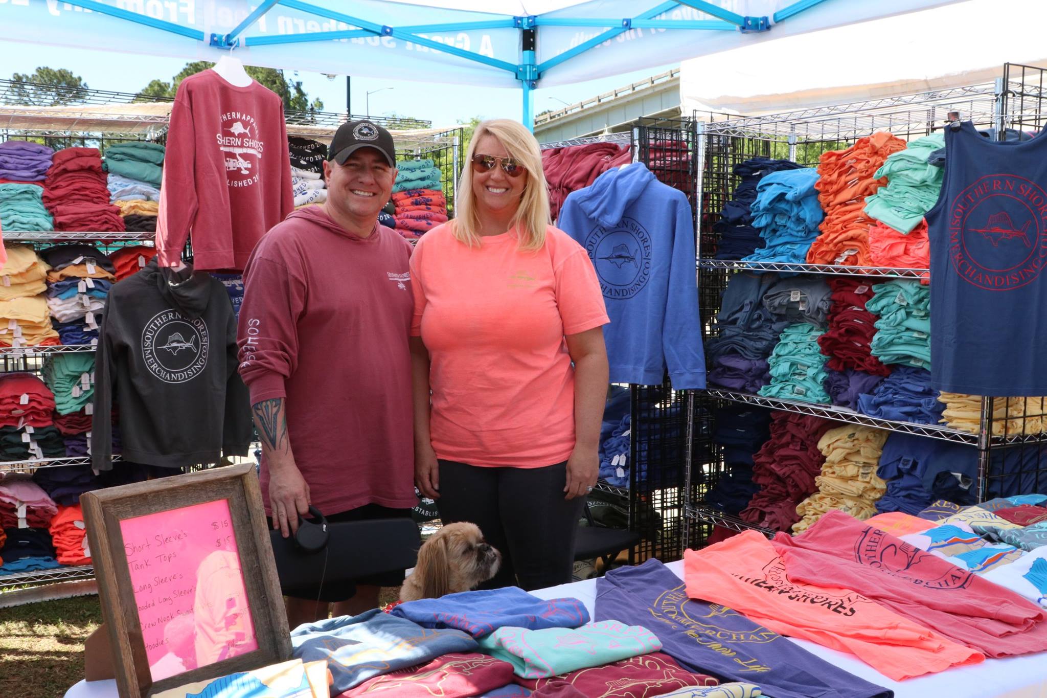 couple standing by t-shirt booth