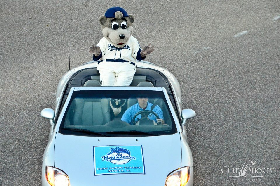 parade floats driving down Highway 59