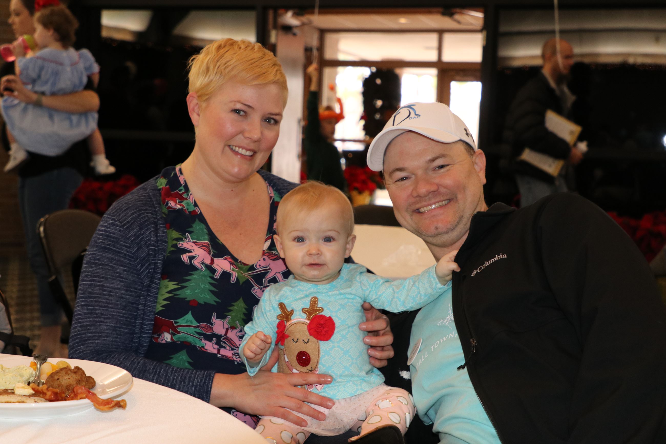 family smiling for photo