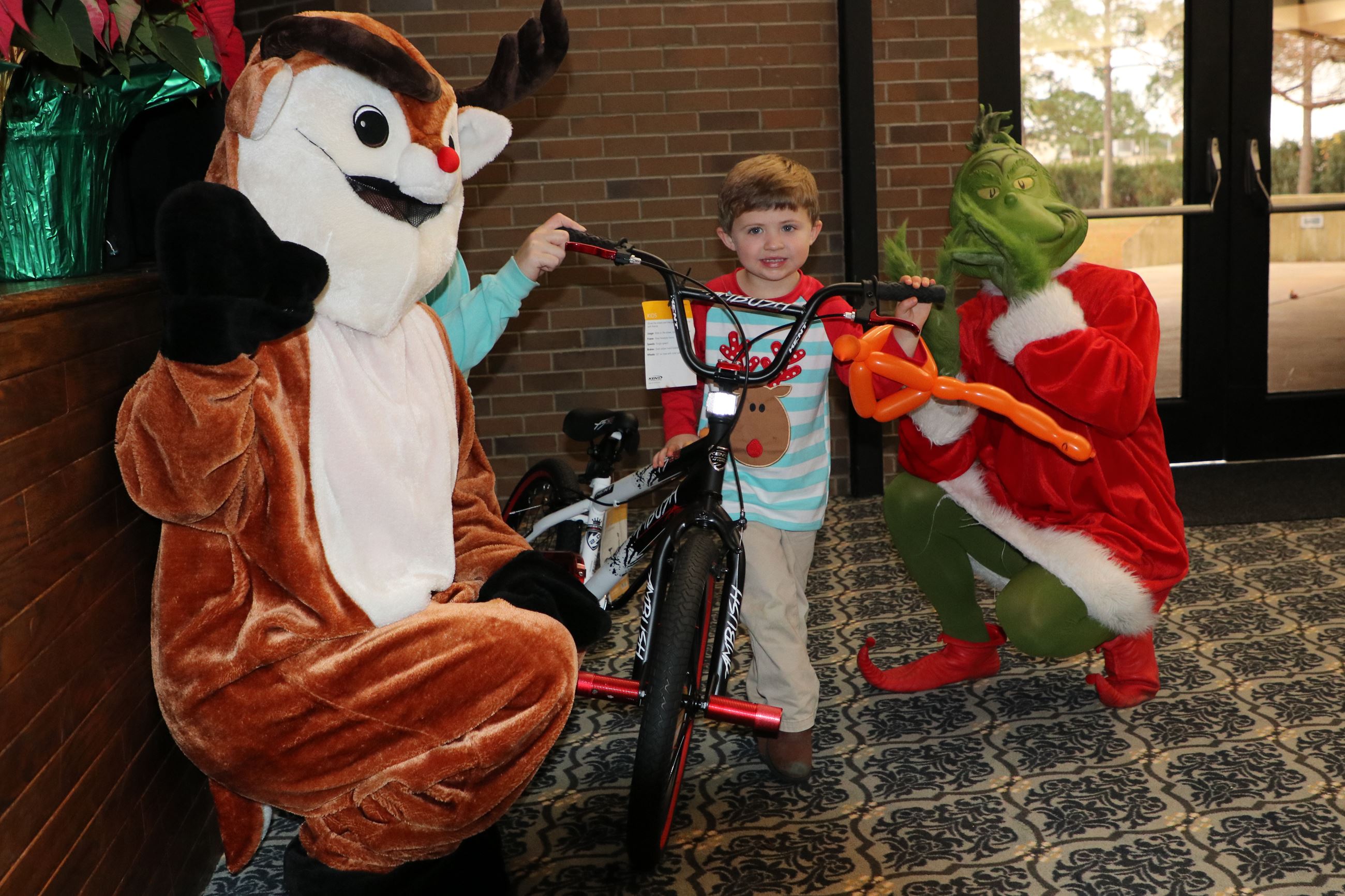 boy getting on his new bike