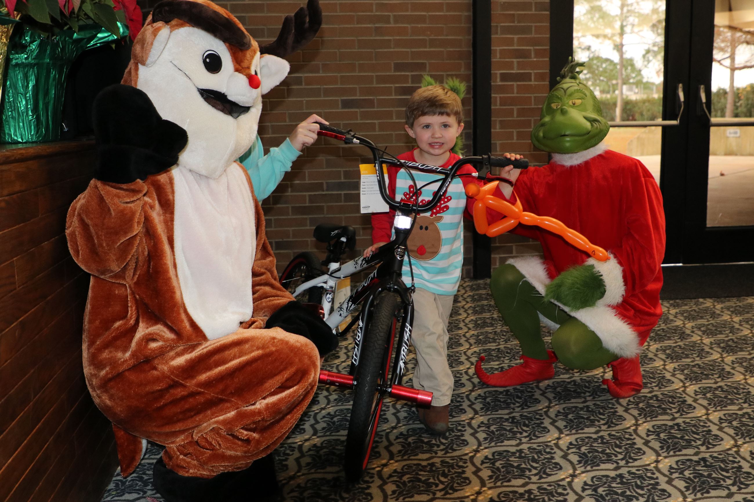 boy getting on his new bike