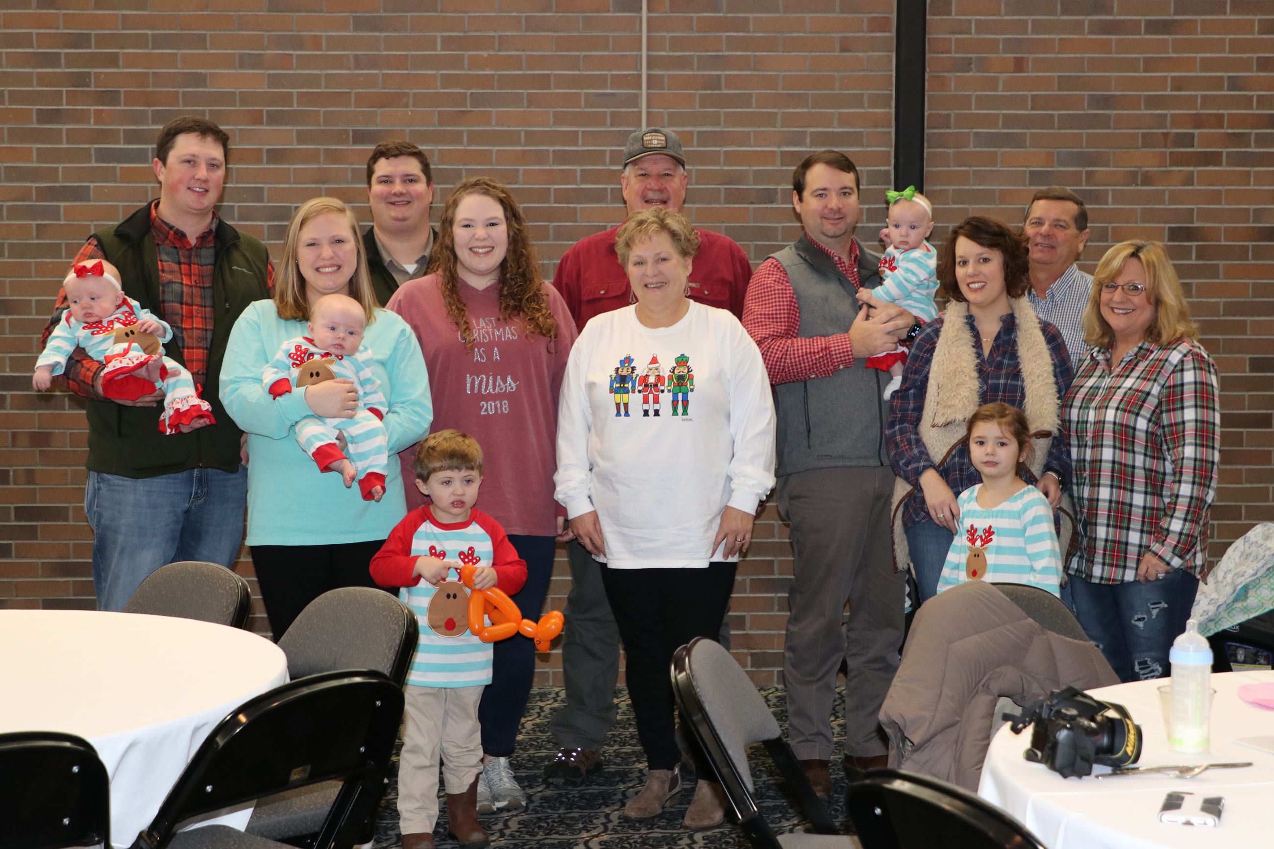 family smiling for photo