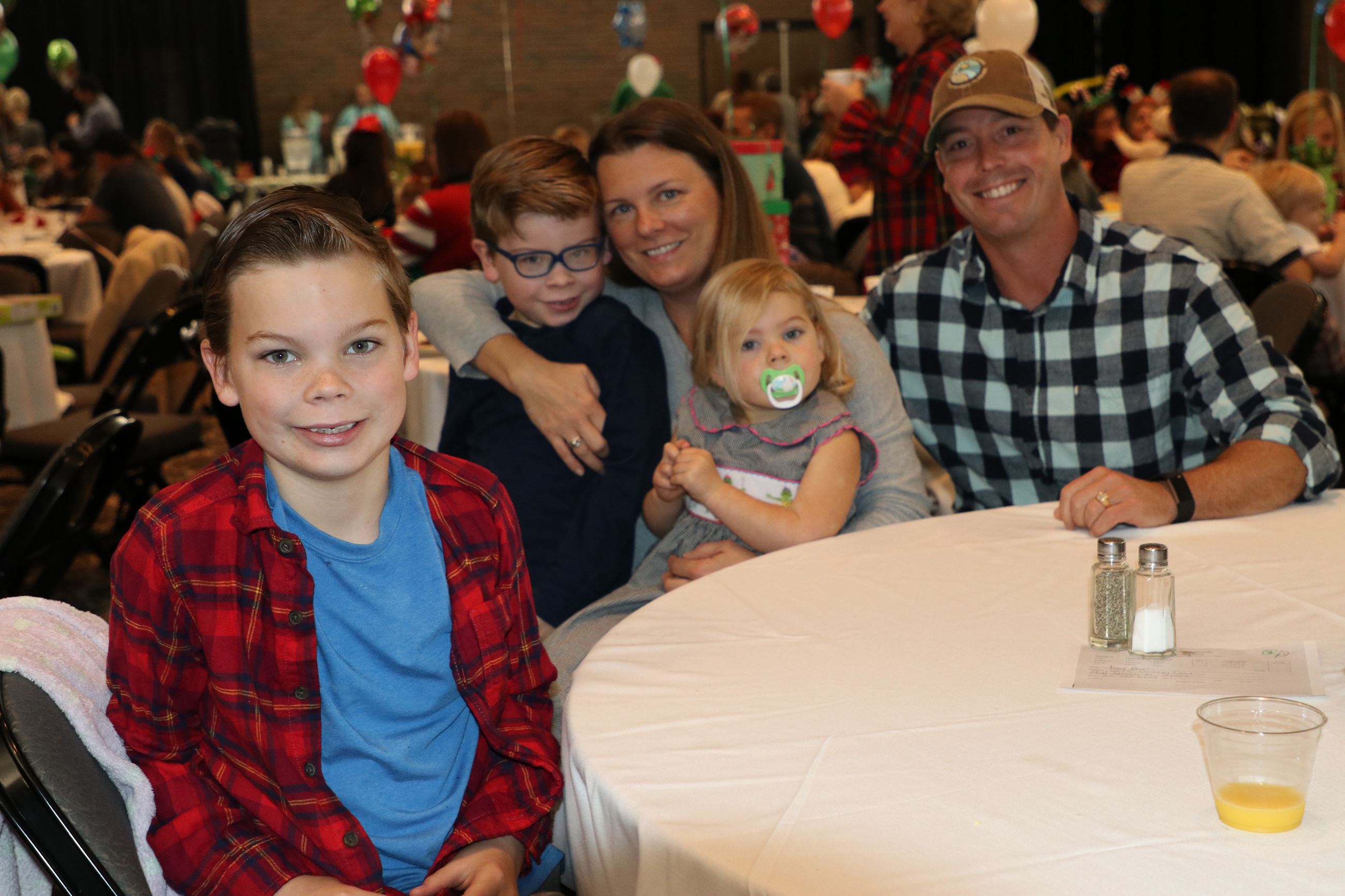 family smiling for photo