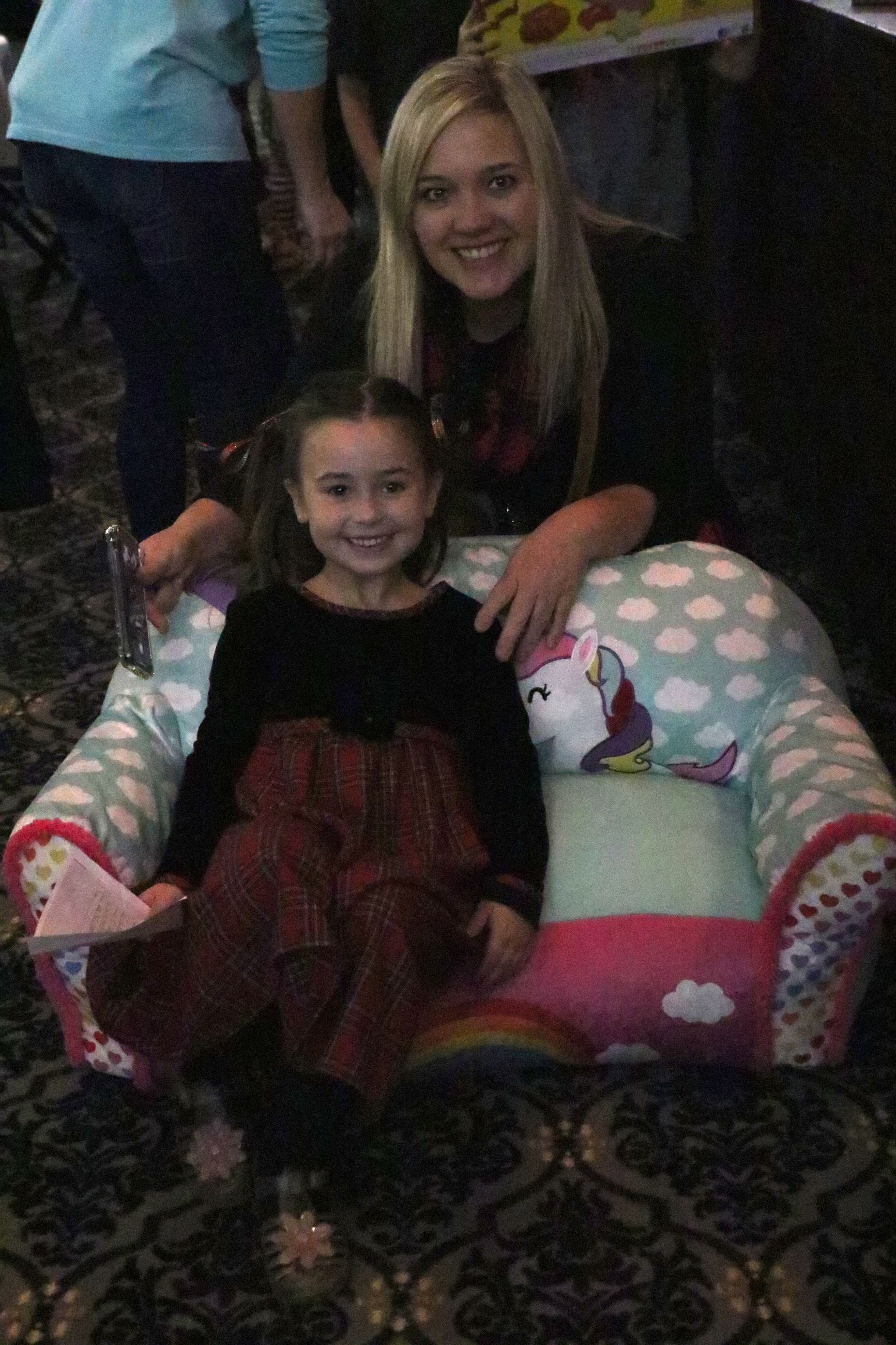 family smiling for photo