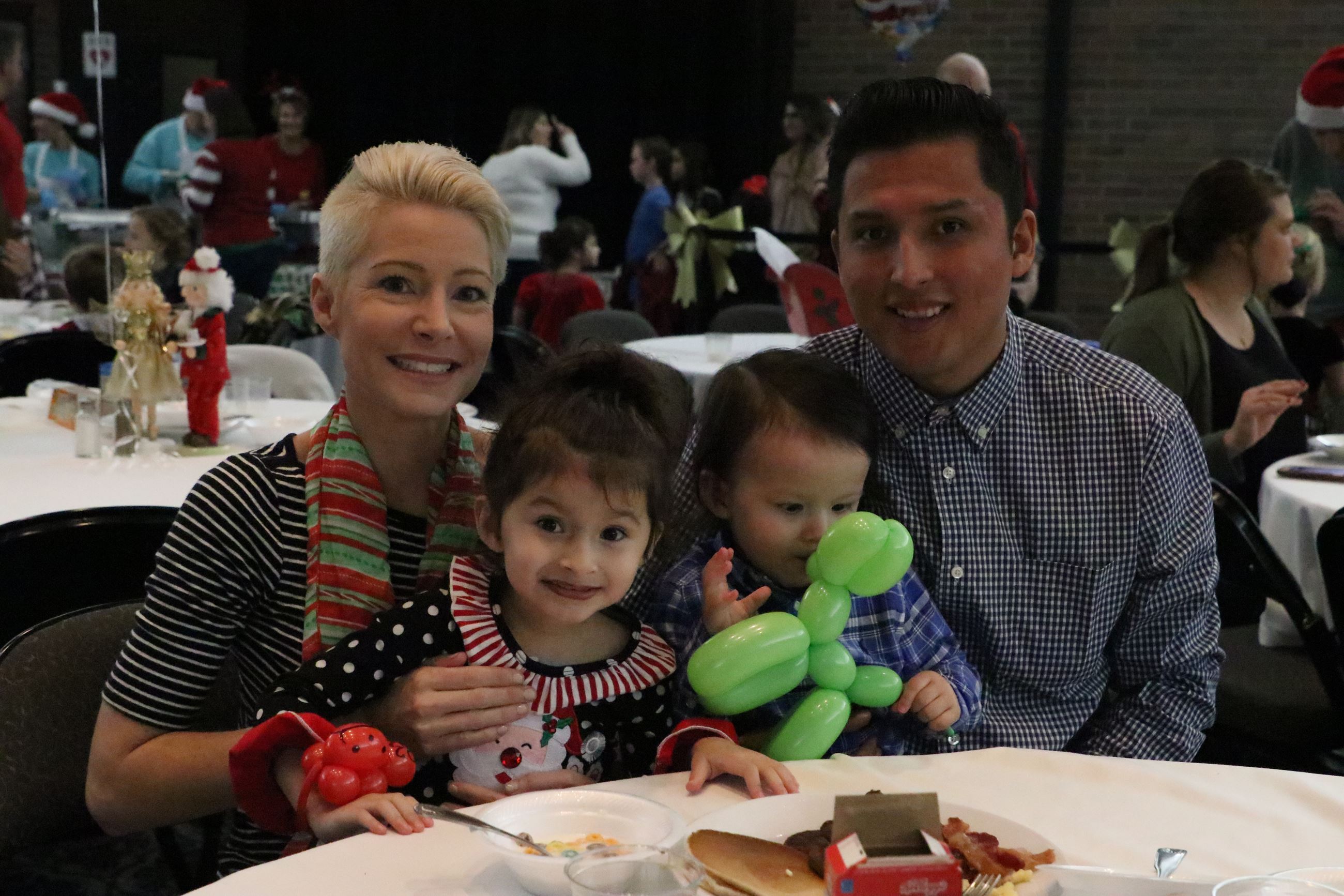 family smiling for a photo