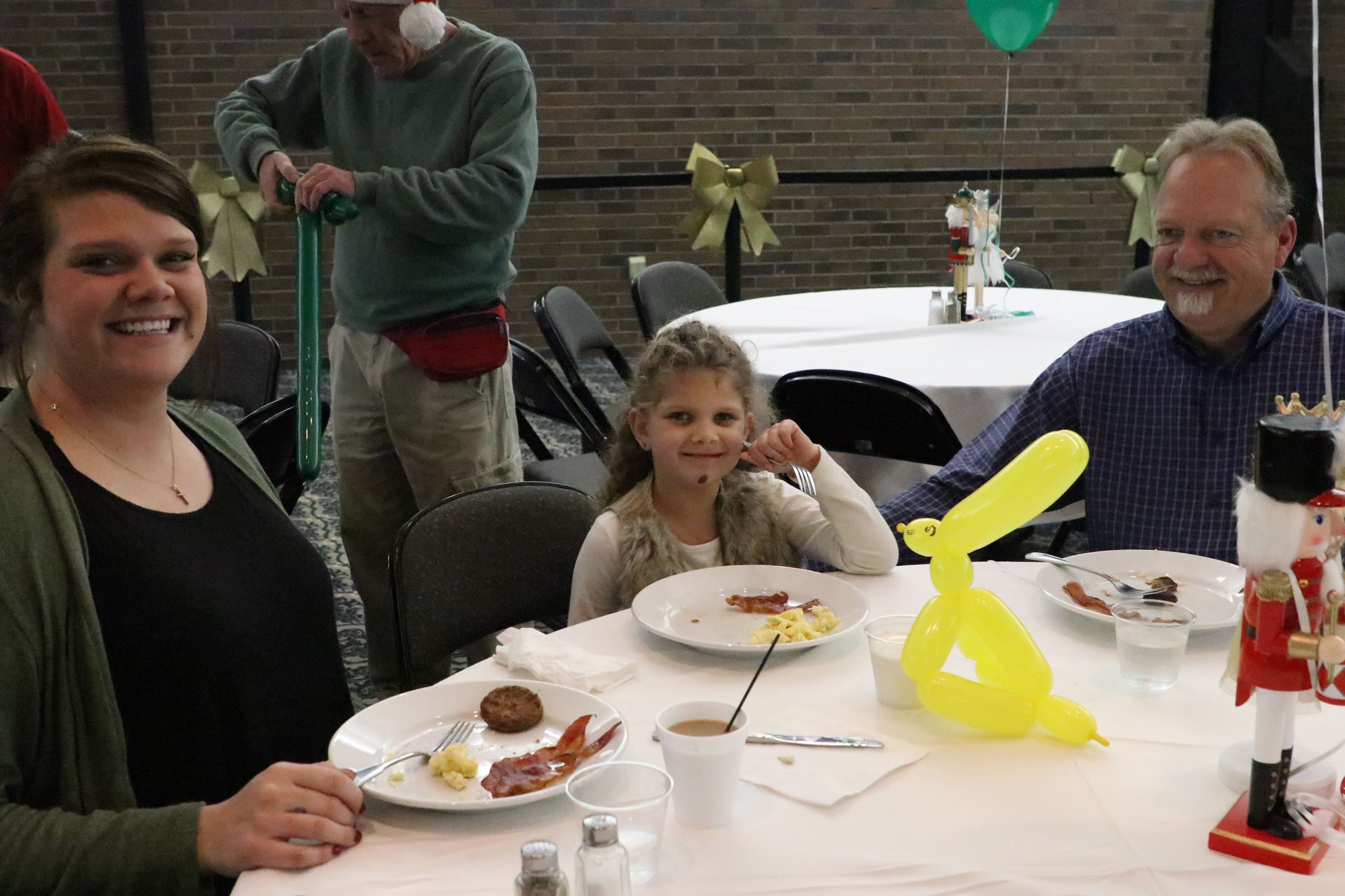 family smiling for a photo