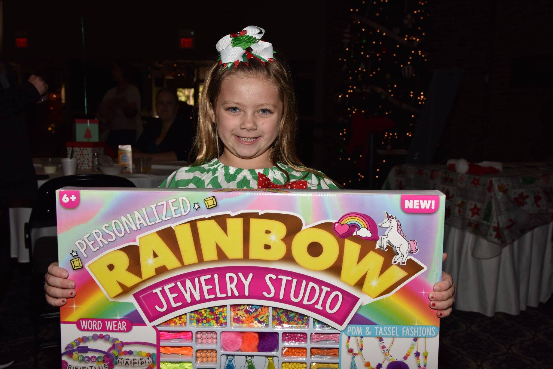 child holding up new toy