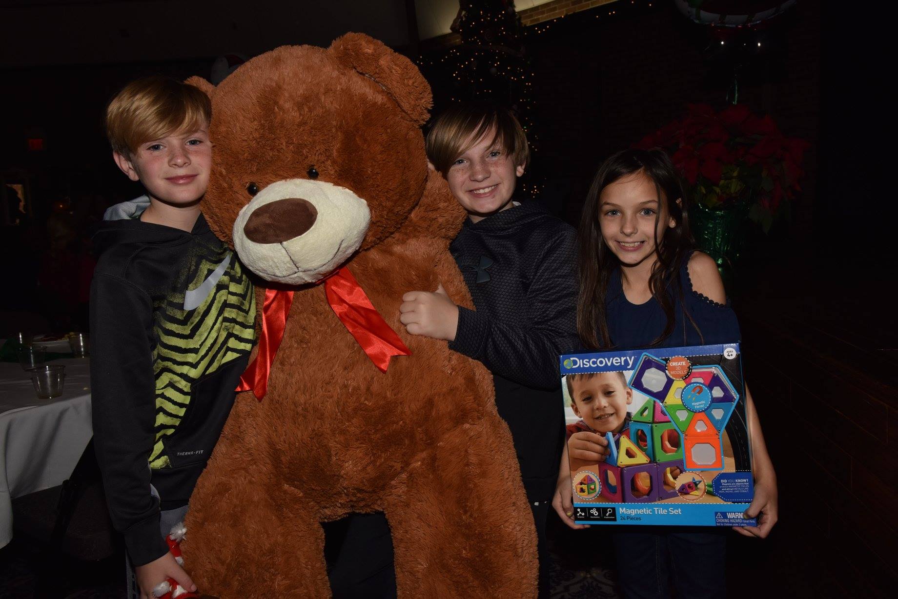 kids holding up new toys