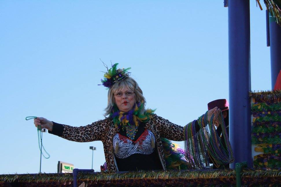 woman throwing beads