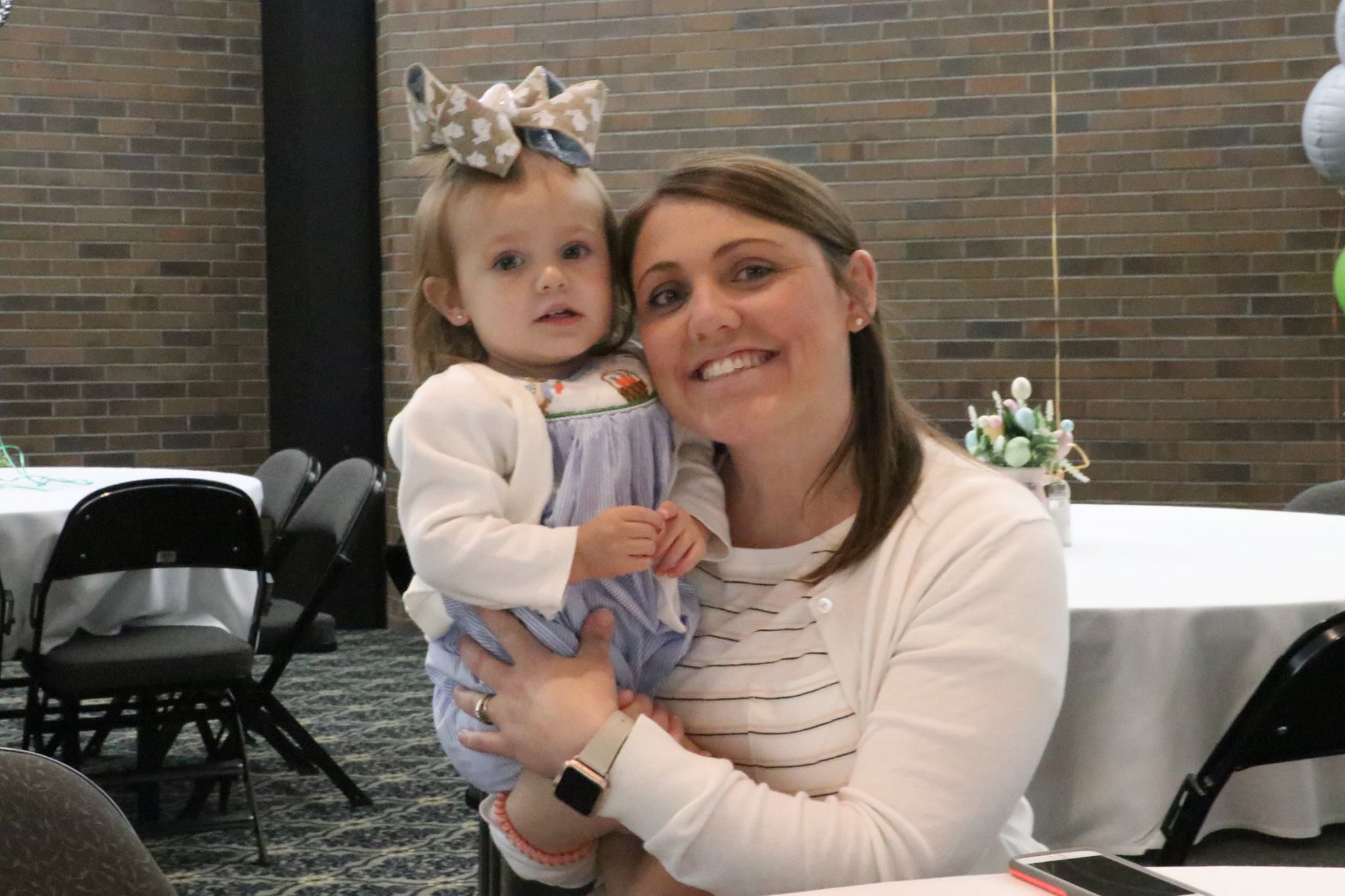 mom and daughter smiling