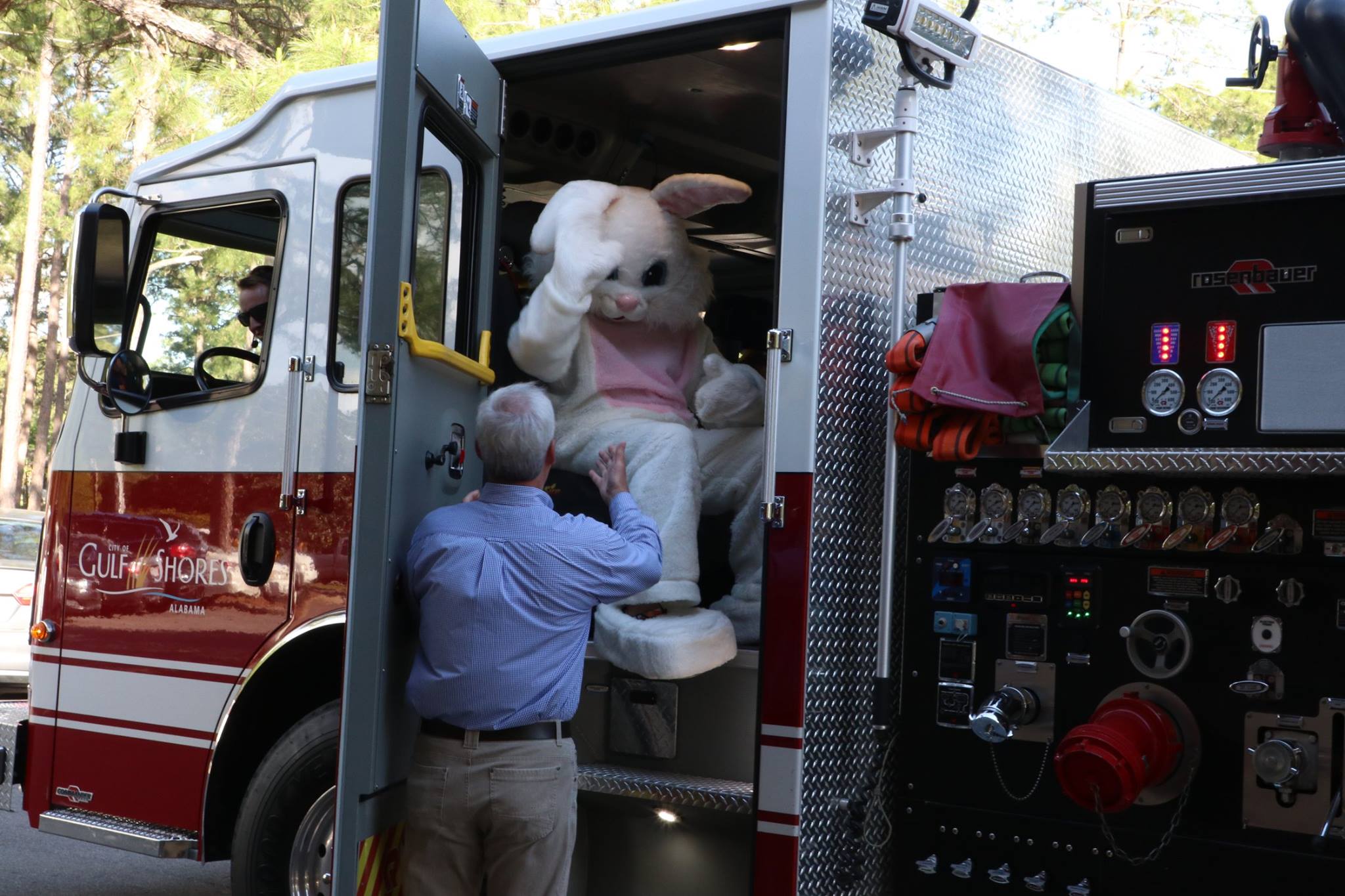 Easter Bunny getting out of the firetruck